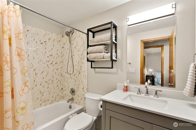 full bathroom featuring vanity, toilet, and shower / tub combo with curtain