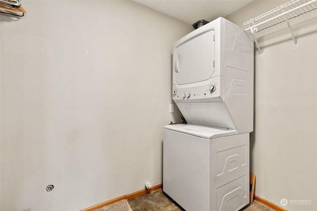 laundry area featuring stacked washer and clothes dryer