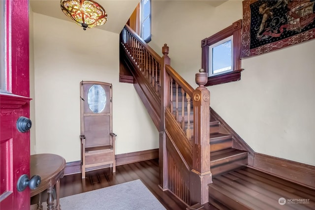 stairs with hardwood / wood-style flooring