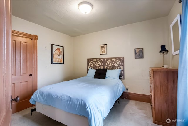 bedroom with light colored carpet