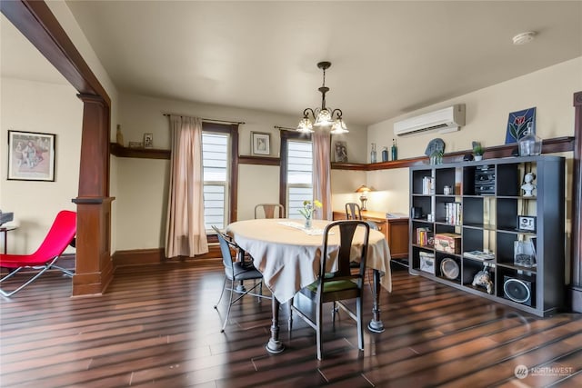 dining room with dark hardwood / wood-style floors, a chandelier, and a wall unit AC