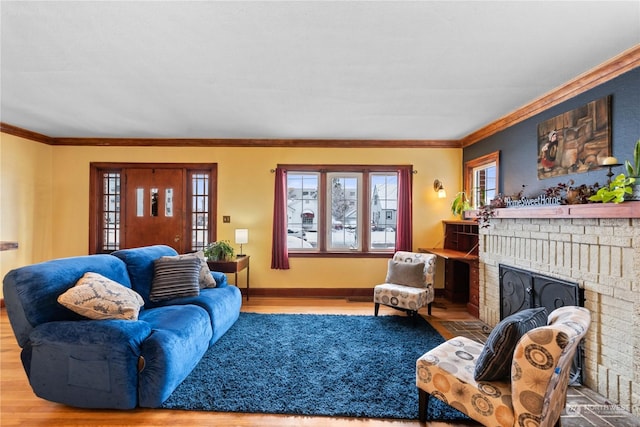 living room featuring hardwood / wood-style floors, a brick fireplace, and ornamental molding