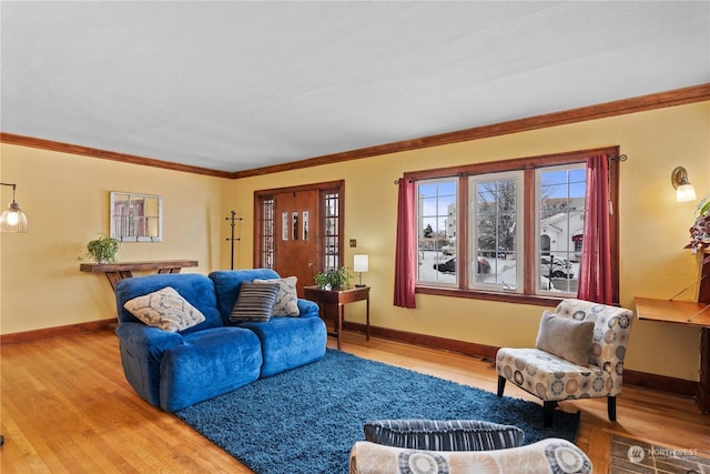 living room with wood-type flooring and ornamental molding