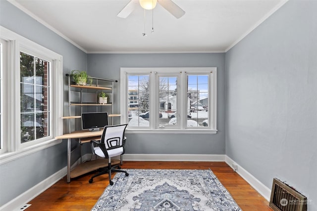 office space with hardwood / wood-style floors, ceiling fan, and ornamental molding