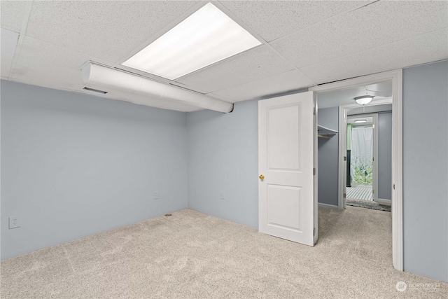 basement with light colored carpet