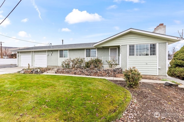 single story home with a garage, covered porch, and a front yard