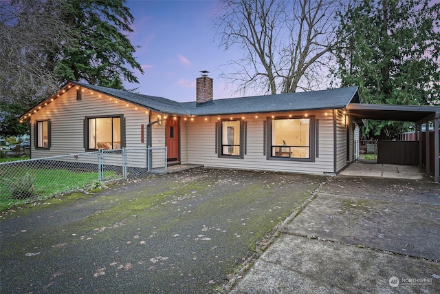 single story home featuring a yard and a carport