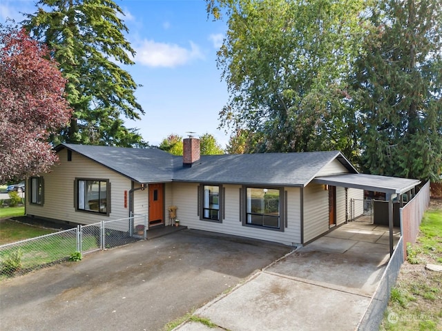 ranch-style home with a carport