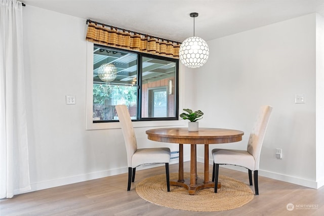 dining space with light hardwood / wood-style floors