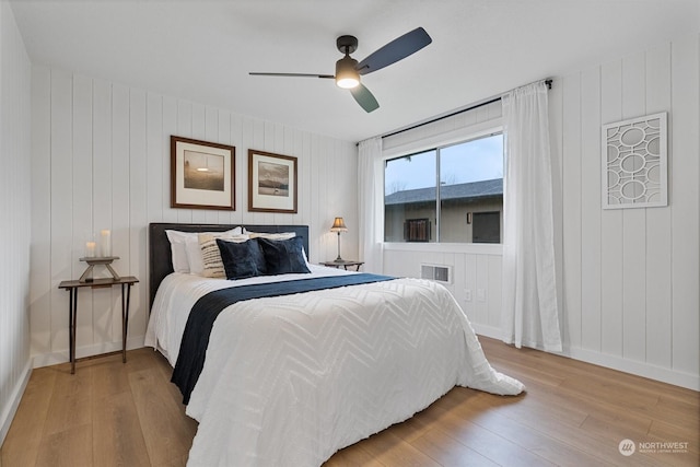 bedroom featuring ceiling fan and light hardwood / wood-style flooring