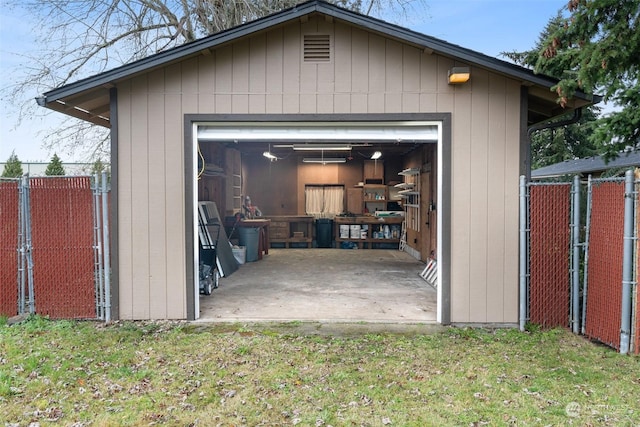 garage with a lawn