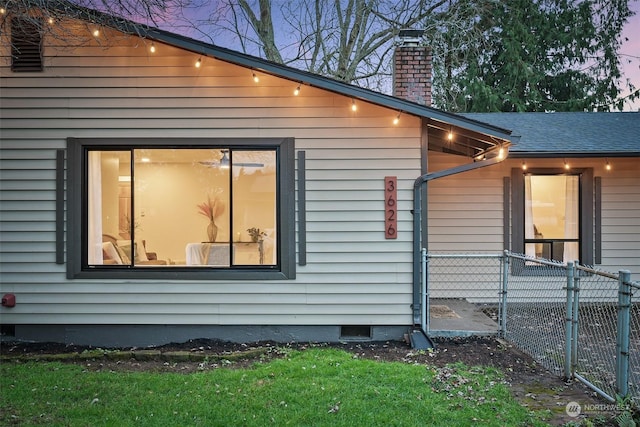 view of property exterior at dusk