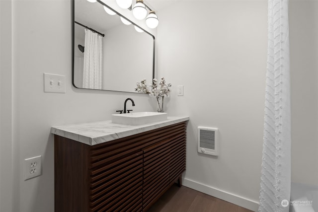 bathroom featuring hardwood / wood-style floors and vanity