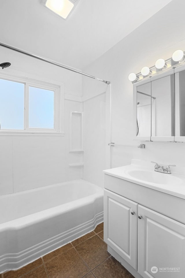 bathroom featuring tile patterned flooring, vanity, and shower / bath combination