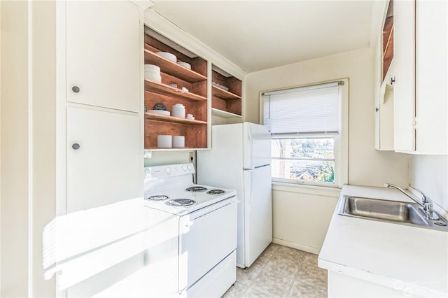 kitchen with sink, white cabinets, light tile patterned flooring, and white appliances