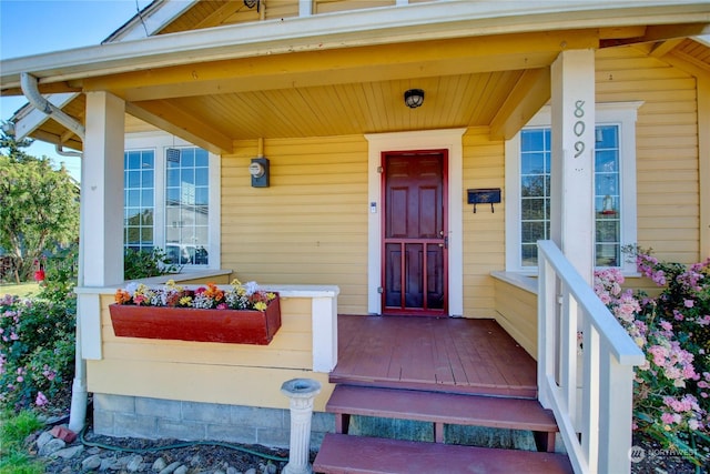 doorway to property with covered porch