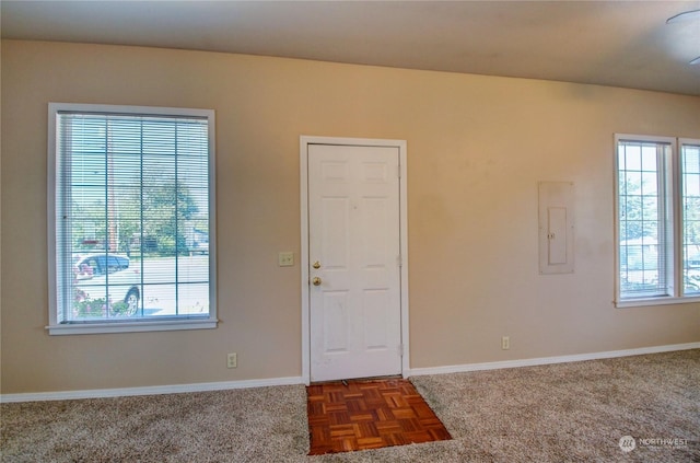 entrance foyer with electric panel and dark parquet floors