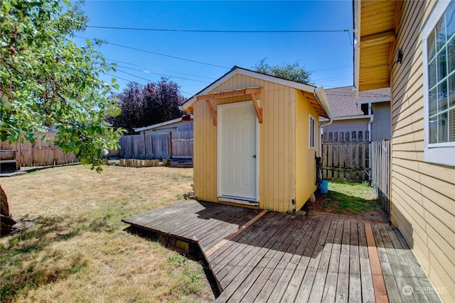 exterior space featuring a storage shed and a lawn