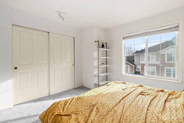 carpeted bedroom with a closet