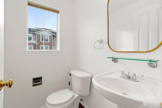 bathroom with toilet and sink