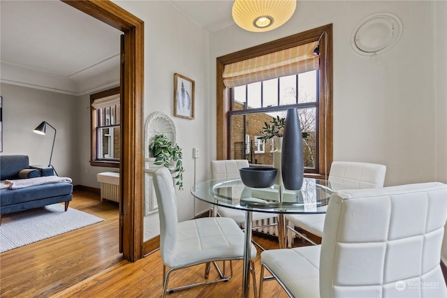 dining area with hardwood / wood-style floors