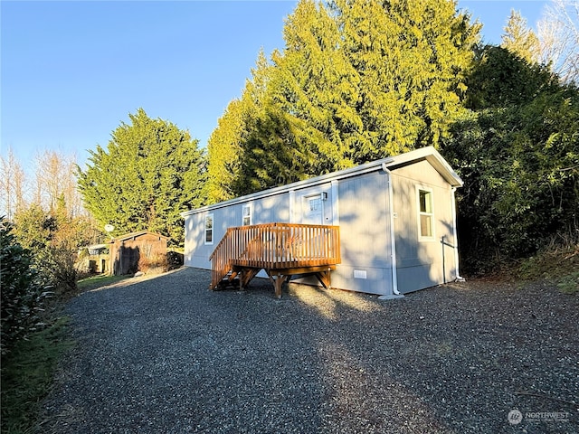 view of front of house with a wooden deck