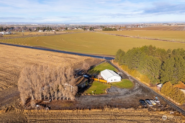 birds eye view of property featuring a rural view