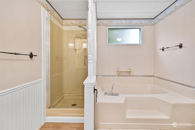 bathroom with shower with separate bathtub