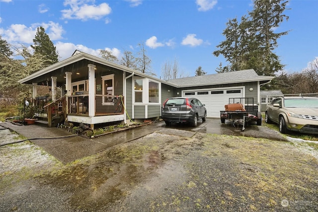 view of front facade featuring a garage and a porch