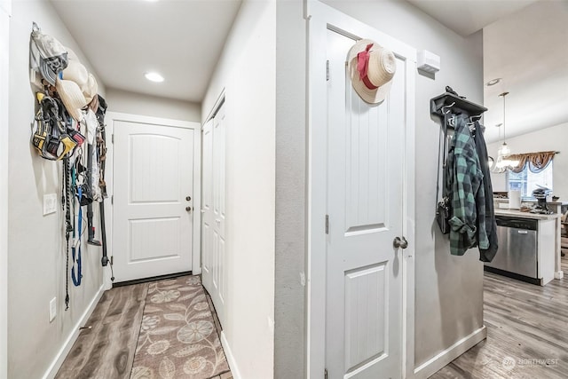 hall with light hardwood / wood-style floors