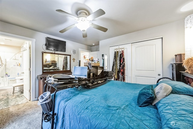 bedroom featuring ceiling fan, connected bathroom, carpet flooring, and a closet