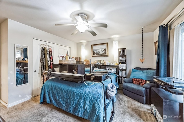 carpeted bedroom with ceiling fan