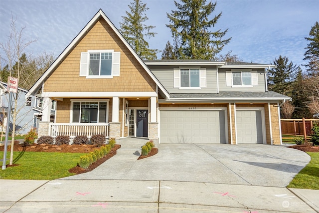 view of front of house featuring a porch and a garage