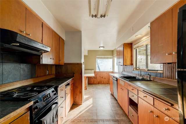 kitchen with sink, tile countertops, dishwasher, black range with electric cooktop, and decorative backsplash