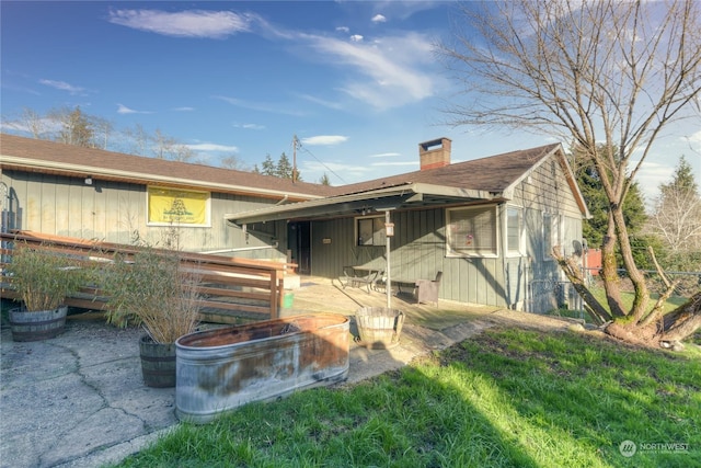 rear view of property with a patio area