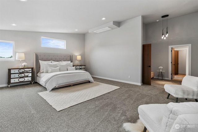 carpeted bedroom with lofted ceiling