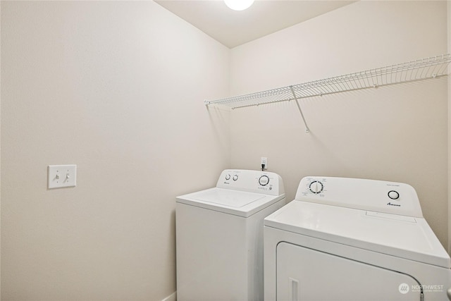 washroom featuring washer and dryer