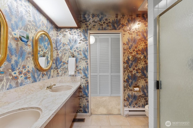 full bathroom featuring a sink, a baseboard radiator, and wallpapered walls