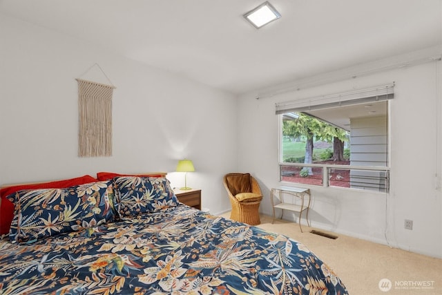 bedroom featuring carpet flooring, baseboards, and visible vents