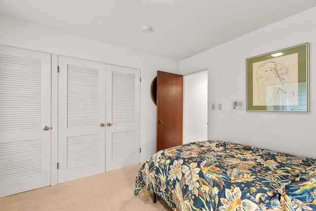 carpeted bedroom with a closet