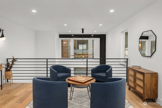 sitting room featuring light hardwood / wood-style floors