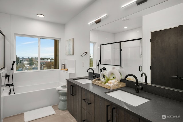 full bathroom with vanity, toilet, and independent shower and bath