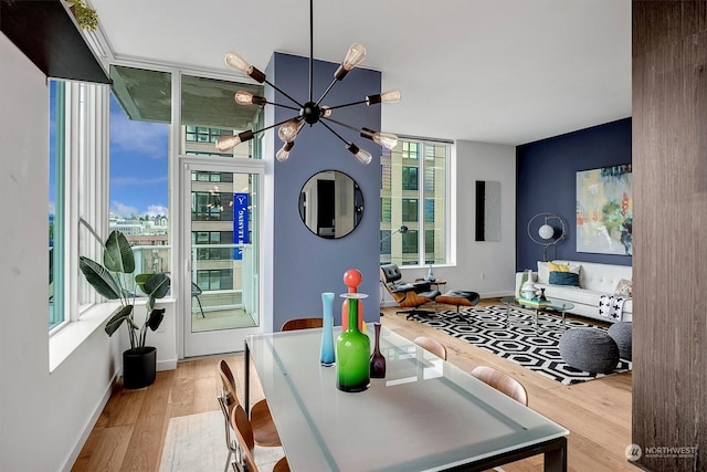 interior space with a notable chandelier and light hardwood / wood-style flooring