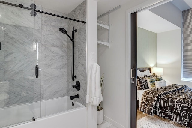 bathroom with shower / bath combination with glass door