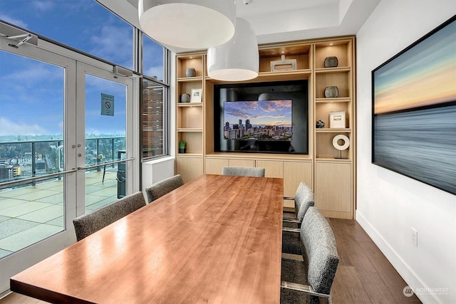 interior space featuring french doors, built in shelves, and hardwood / wood-style flooring