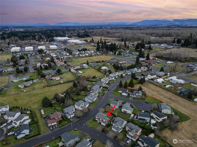 aerial view at dusk with a mountain view