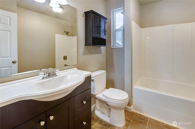 full bathroom featuring tile patterned flooring, vanity, bathtub / shower combination, and toilet