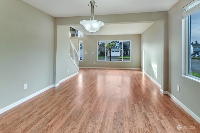 spare room featuring light hardwood / wood-style flooring