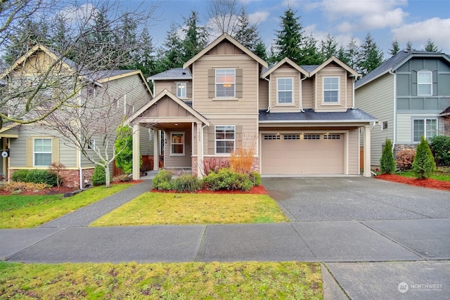 craftsman-style home featuring a front yard and a garage