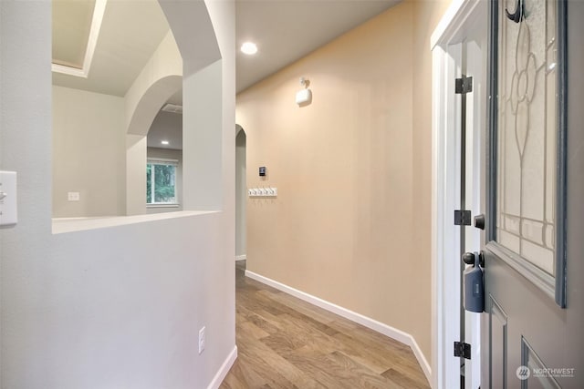 corridor featuring light hardwood / wood-style floors